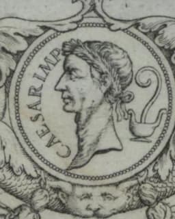 Coin-style medallion portrait of Julius Caesar wearing a laurel wreath